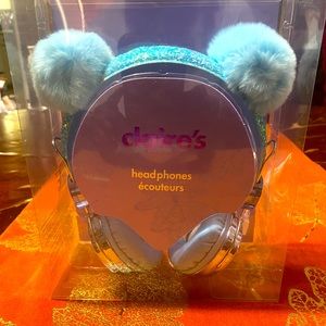 Light blue fuzzy Claire’s headphones.
